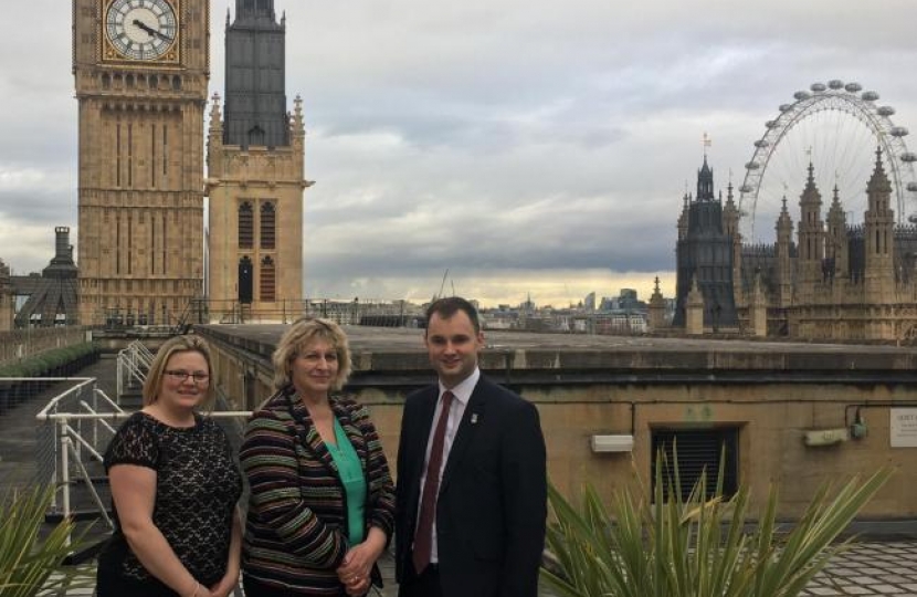 Luke with the Rose and Crown owners on the roof of Parliament